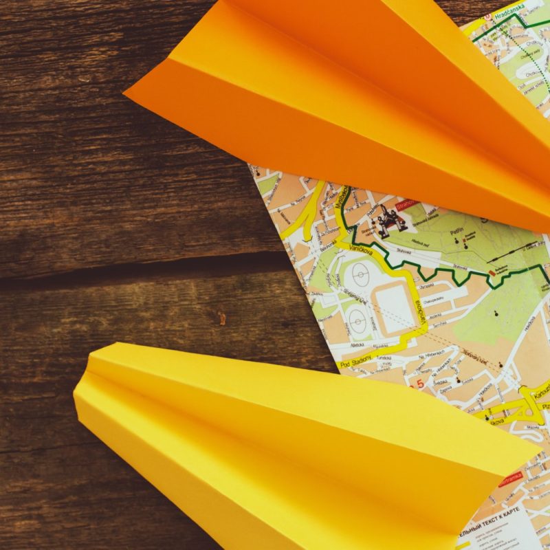 Travel. Paper airplanes on the table